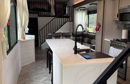 Fair Play House | Not camping, GLAMPING! Beautiful 45’ park model RV. Adults over 18 only.
