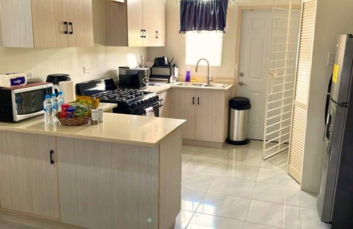 Discovery Bay Villa | Ocean View 2-bedroom villa with AC, WiFi in Discovery Bay Beach/Pool Access