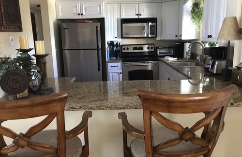 Central Beach Condo | Oceanfront 2B Gem .March-!.Aug.custom kitchen West Indies,decor Heated.Pool.