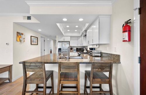 Balboa Peninsula Apartment | Oceanfront Boardwalk property, Newly remodeled Large patio, Steps to the sand.