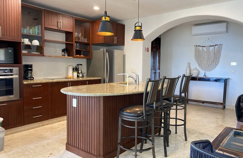 Majahual Apartment | Oceanfront penthouse with private rooftop, pool and bbq area