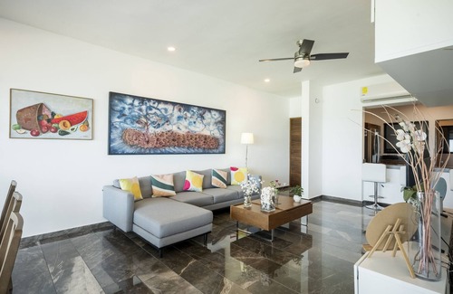 Ixil Apartment | Oceanfront retreat with private balcony, outdoor pool, and stunning views
