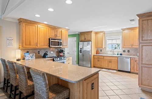 Ocean Isle Beach House | OIB Canal Home - GREAT outdoor - under house & screen porch, LARGE kitchen, DOCK