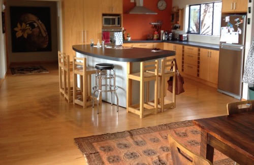 Raglan House | Okete Landing - Lifestyle retreat on Raglan harbour with grass tennis court.
