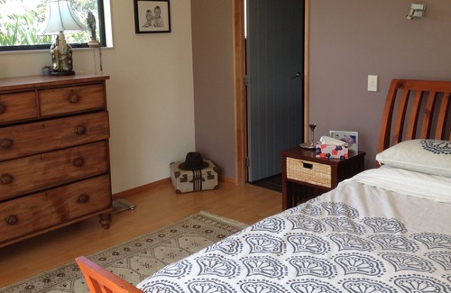 Raglan House | Okete Landing - Lifestyle retreat on Raglan harbour with grass tennis court.