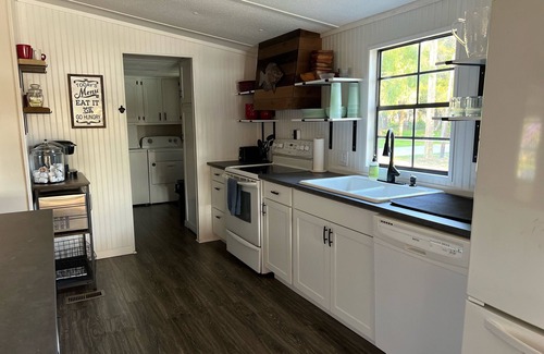 Suwannee House | Old Florida Waterfront Getaway - Large Porch, Big Dock, & Pet Friendly