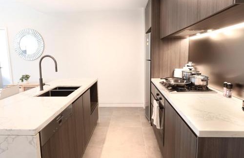 Lidcombe Apartment | Olympic Park 2BR Pool gym access and walk to stadium