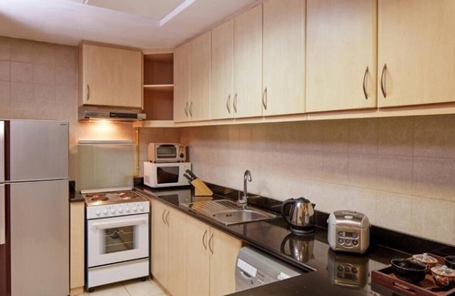 Discovery Gardens Hotel | One Bedroom Apartment In Discovery Gardens By E R