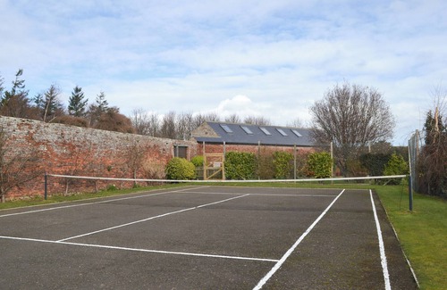 Warenford Cottage | One of five holiday homes with swimming pool, gym and tennis courts on site.