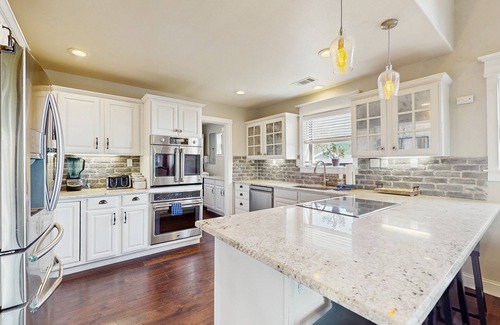 Burnet House | Opulent waterfront home with dock, firepit & stunning river view