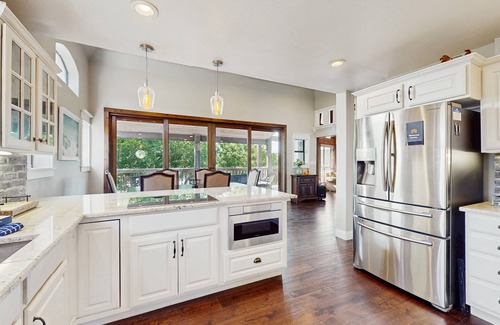 Burnet House | Opulent waterfront home with dock, firepit & stunning river view
