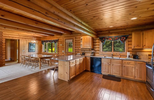 Ennis House | Our ultimate luxury Montana log cabin. Special highlights include a vaulted ceiling, an expansive rock fireplace and spectacular views of the Madison Range.