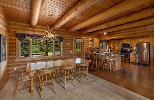 Ennis House | Our ultimate luxury Montana log cabin. Special highlights include a vaulted ceiling, an expansive rock fireplace and spectacular views of the Madison Range.