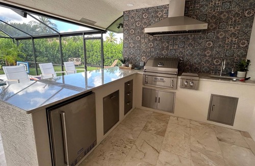 Boca Raton House | Outdoor paradise - pool/spa/kitchen with Spacious Home