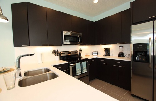 Four Corners House | Outstanding, owner operated Townhome, even a TV in the pool area!