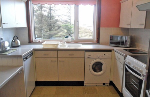 South Erradale Cottage | Overlooking the sweeping sandy bay of Opinan on the stunning west Highland coast .