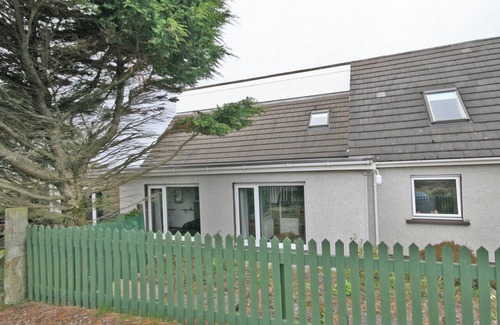 South Erradale Cottage | Overlooking the sweeping sandy bay of Opinan on the stunning west Highland coast .