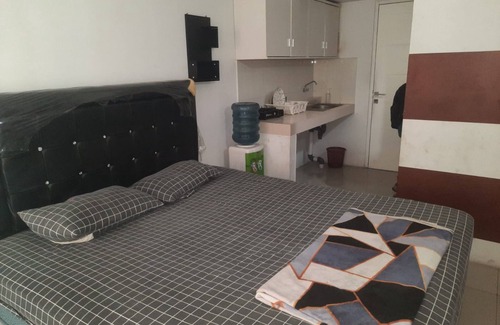 Karawang Hotel | OYO Life 93139 Apartemen Grand Sentraland By Evi