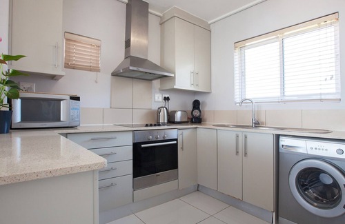 Lagoon Beach Apartment | Panoramic Views with Balcony, Beach and Bar Access