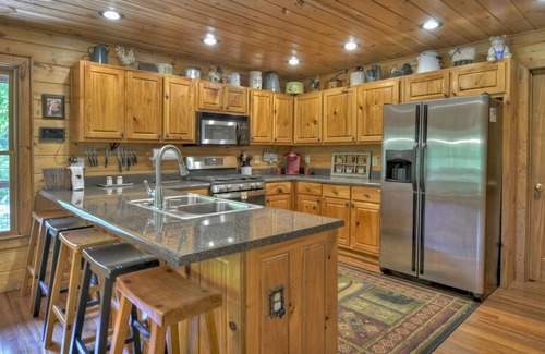 Cherry Log Cabin | Papa Bear Lodge is a Pet-friendly haven featuring hot tub, outdoor fireplace, firepit, pool table, WiFi, and secluded ambiance for unparalleled relaxation