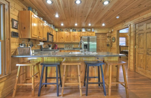 Cherry Log Cabin | Papa Bear Lodge is a Pet-friendly haven featuring hot tub, outdoor fireplace, firepit, pool table, WiFi, and secluded ambiance for unparalleled relaxation