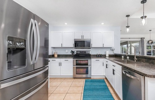 Cape Coral Villa | PARADISE COVE- Spacious Canal Home with htd saltwater Pool! Sleeps 13!