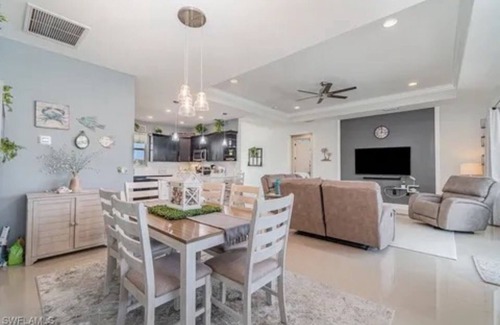 Trafalgar House | Paradise of Cape Coral on Canal, with Heated Pool, Tiki Hut Grill & Elec Bikes