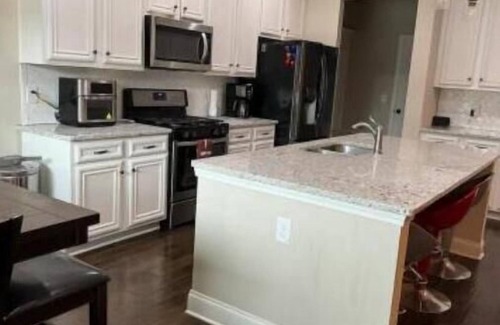 Buford House | Peaceful Family Retreat, Cozy Fireplace, Ping Pong, & Fenced Backyard Oasis