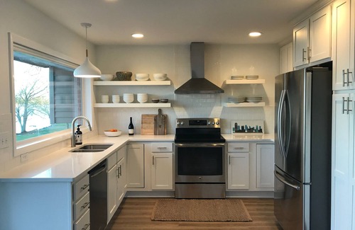 Lebanon House | Peaceful Lakefront Home with spacious Deck and Lawn Leading Down to Lake