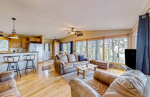 Wisconsin Dells House | Peaceful river view home with a furnished deck, firepit, central AC, & WiFi