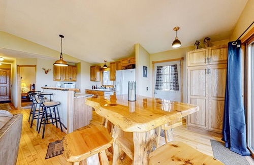 Wisconsin Dells House | Peaceful river view home with a furnished deck, firepit, central AC, & WiFi