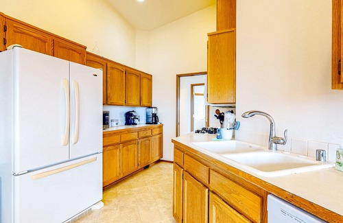 Oak Harbor House | Peek-a-boo ocean view home with outdoor living space, W/D, and balcony