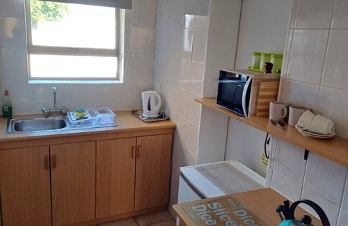 Kleinmond Apartment | PERIWINKLE 5: Bachelors apartment, own BBQ area, near BEACH and SHOPS