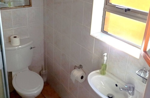 Kleinmond Apartment | PERIWINKLE 5: Bachelors apartment, own BBQ area, near BEACH and SHOPS