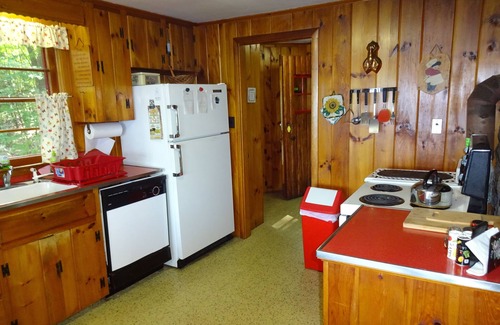 Naples Cottage | Pet friendly, cozy Maine log cabin surrounded by woods with beautiful views!