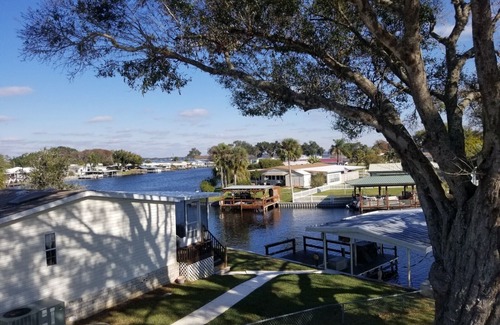 Tavares House | PETS STAY FREE Canal Front 3 bed/2 bath single family ample parking