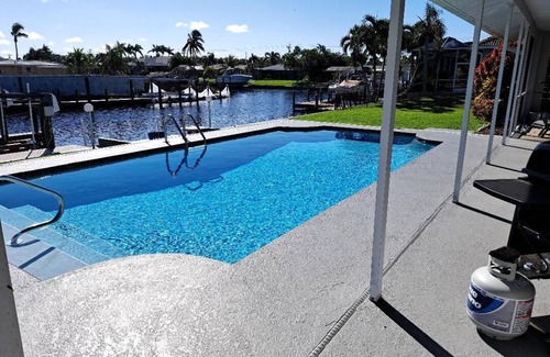 Eight Lakes House | Playful Pelican 3/2 waterfront pool house w. direct access to Gulf SW Cape Coral