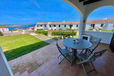 Arenal d'en Castell Apartment | Ponent - Planta baja con vistas al mar y piscinas