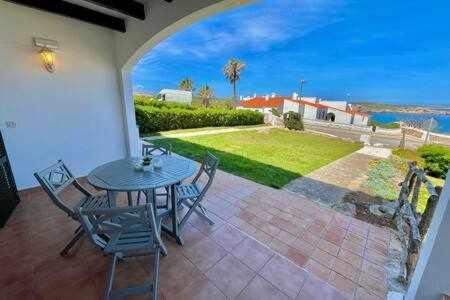 Arenal d'en Castell Apartment | Ponent - Planta baja con vistas al mar y piscinas