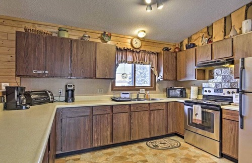 Ironwood Apartment | Private and cozy Townhouse #102 in the Townhouse Village at North Ironwood Acres resort on the Black River Scenic Byway. Beautiful wood theme through out with wood burning fireplace and onsite Laundry. Sleeps 1-6. DOG FRIENDLY!