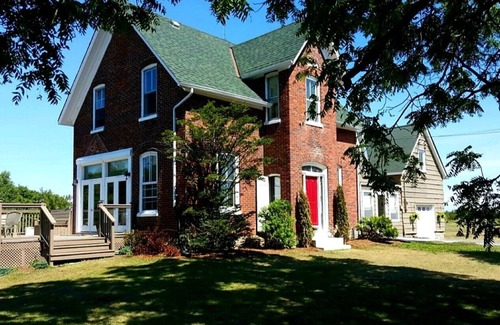 Milford House | Private Century Home Waterfront Getaway with Acreage