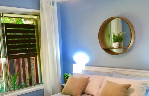 Currumbin Waters House | Private Coastal Retreat: lush tropical gardens, private resort pool w waterfall