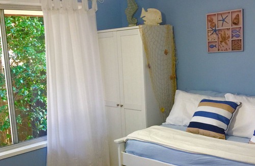 Currumbin Waters House | Private Coastal Retreat: lush tropical gardens, private resort pool w waterfall