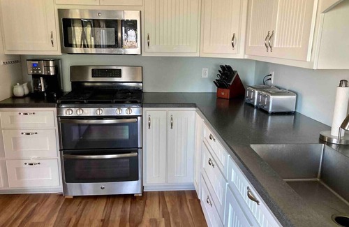 Huron House | Private heated pool in back & Sandy beach in front