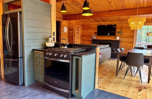 Presque Isle Cabin | Private Lakefront with Beautiful Sunsets, Kayaks, Large Decks, FirePit, & Wi-Fi