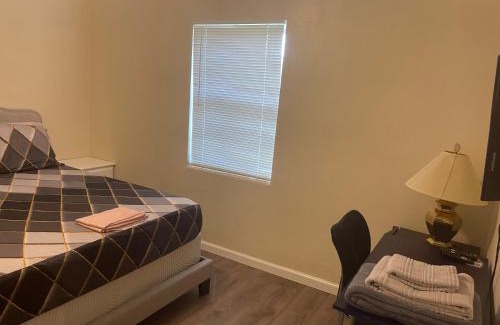 Fort Pierce North House | Private Queen Bedroom C shared common spaces