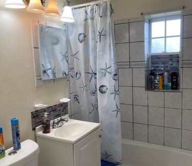 Fort Pierce North House | Private Queen Bedroom C shared common spaces
