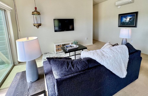 East End Apartment | Private room in modern building top floor corner. Greenbelt and mountain views!