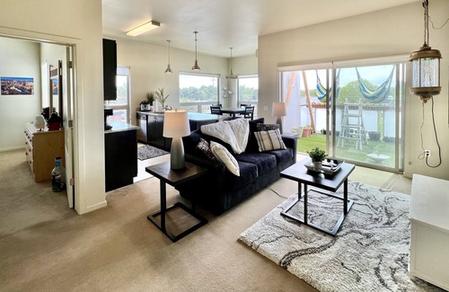 East End Apartment | Private room in modern building top floor corner. Greenbelt and mountain views!