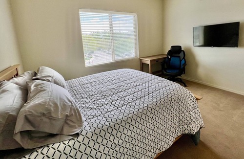 East End Apartment | Private room in modern building top floor corner. Greenbelt and mountain views!